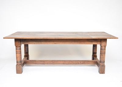 Lot 519 - An oak refectory type dining table
