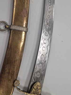 Lot 221 - An Indian-made sabre and scabbard with horse head handle