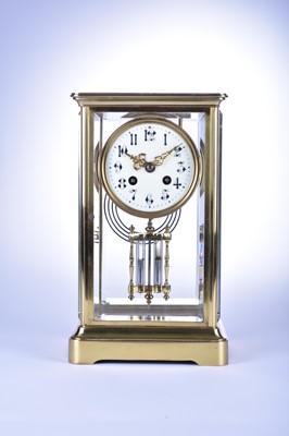 Lot 527 - A brass cased, 4 glass clock by ‘Marti et cie’