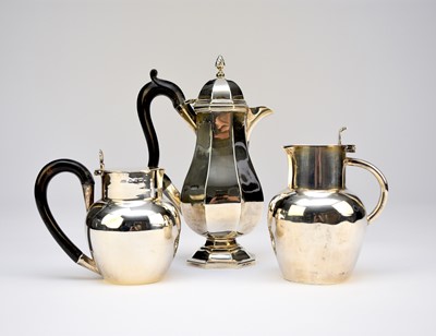 Lot 1 - A silver hot water jug and two silver jugs