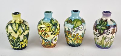 Lot A Moorcroft trial set of four 'The Seasons' vases designed by DJ Hancock