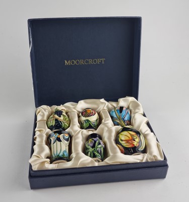 Lot A set of six Moorcroft miniature vases, in fitted case.