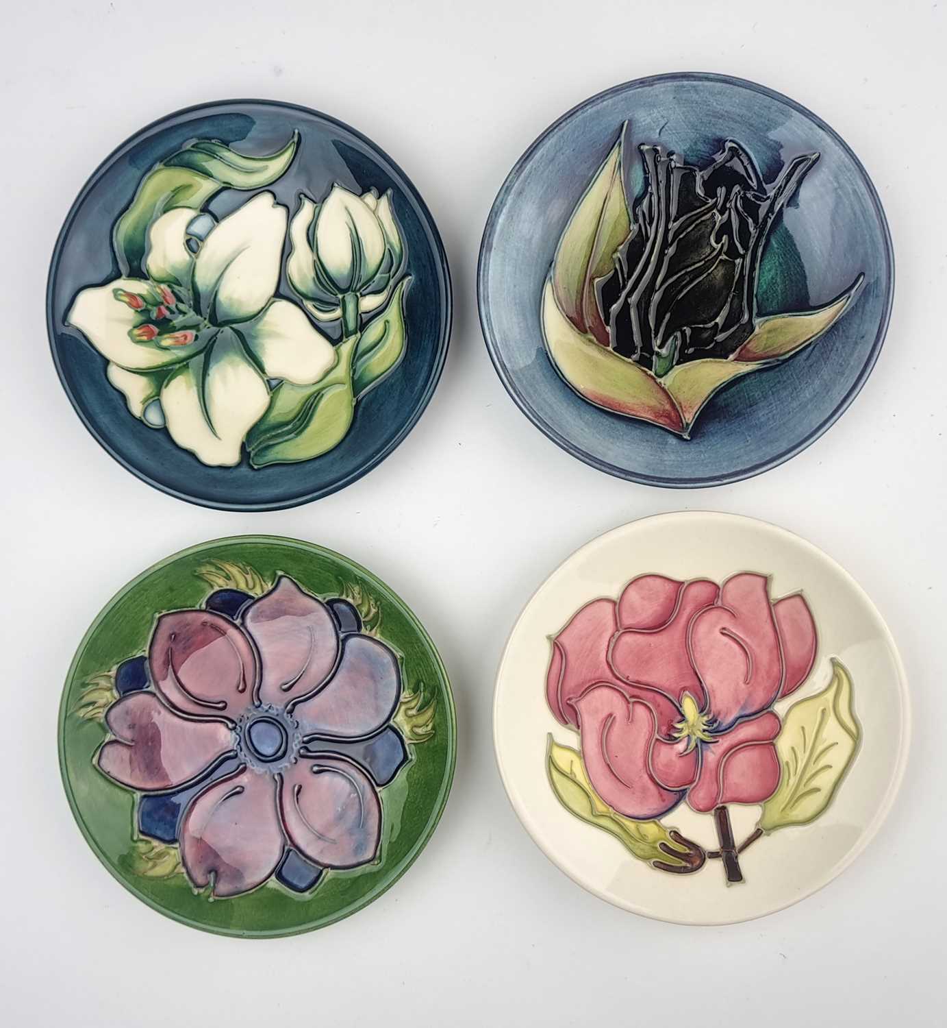 Lot Four Moorcroft pin dishes including Bermuda Lily and Black Tulip