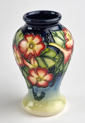 Lot A small Moorcroft vase in the Hummingbird pattern designed by Anji Davenport