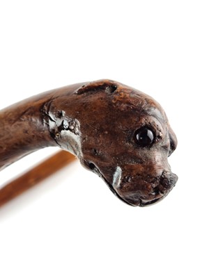Lot Victorian sword cane with a handle carved as a dog with red glass eyes