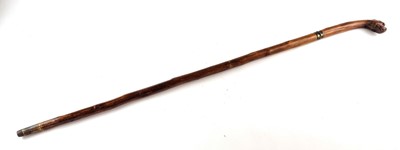 Lot Victorian sword cane with a handle carved as a dog with red glass eyes