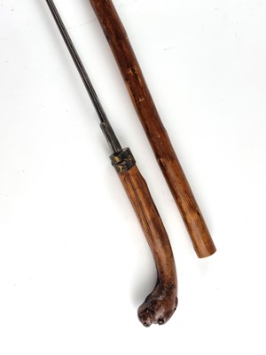Lot Victorian sword cane with a handle carved as a dog with red glass eyes