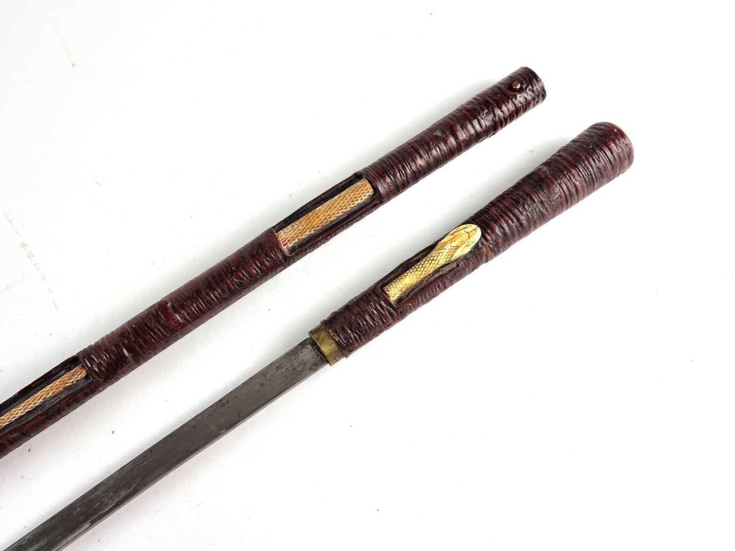 Lot An unusual Indian sword cane, circa 1900, decorated with a snake