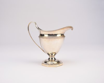 Lot 9 - A George III silver pedestal cream jug