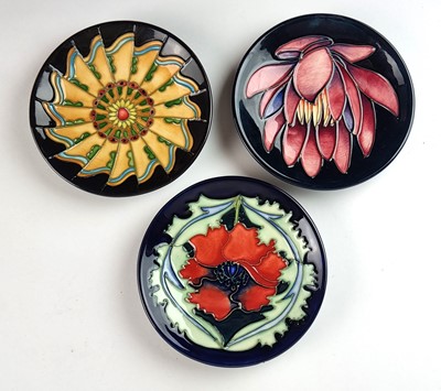 Lot Three Moorcroft pin dishes including May Lily and Moorcroft Poppy