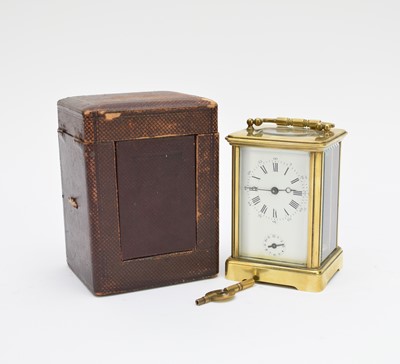 Lot 534 - A French gilt brass carriage alarm clock with carrying case