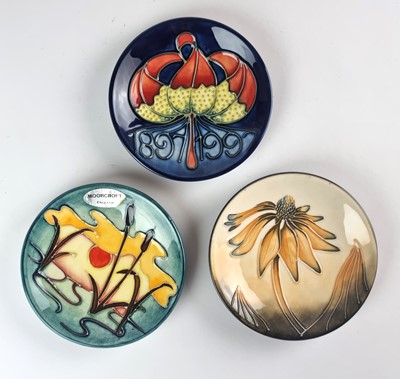 Lot 242 - Nine Moorcroft pin dishes including Hibiscus, Hellebore and Coneflower