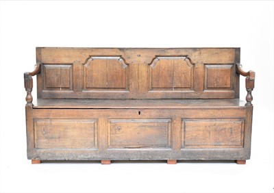 Lot 391 - An 18th century oak box settle