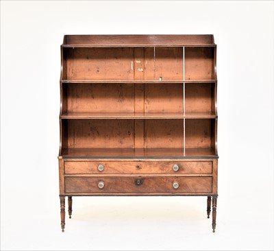 Lot 406 - A George IV or William IV ebony-strung mahogany waterfall bookcase