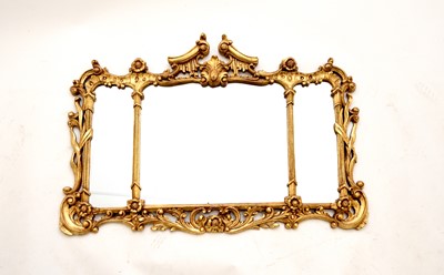 Lot 466 - A reproduction rococo giltwood style mirror