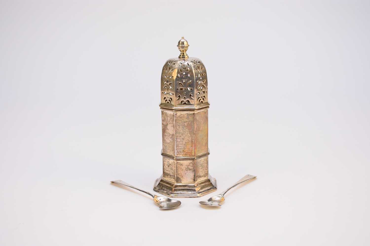 Lot 17 - An octagonal silver sugar caster and two cruet spoons
