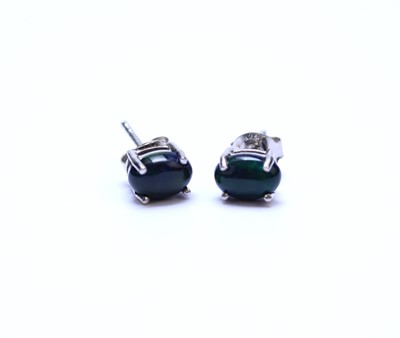 Lot 49 - A pair of Ethiopian cabochon black opal stud earrings
