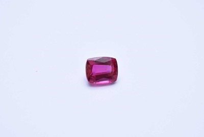 Lot 186 - An unmounted cushion cut synthetic pink sapphire