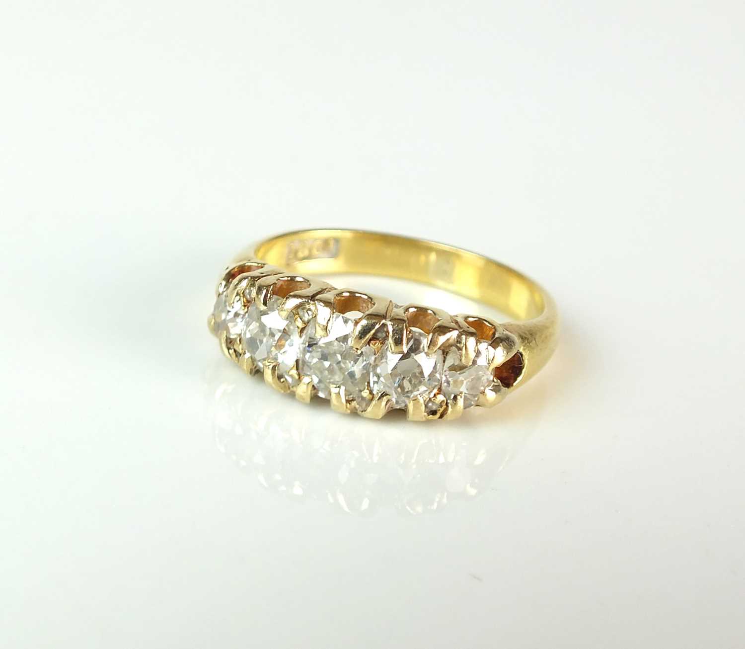 Lot 86 - A late 19th century graduated five stone old mine cut diamond ring