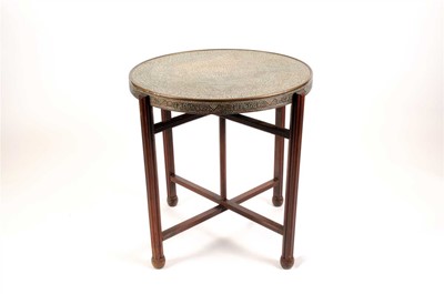 Lot 301 - An early 20th century central Asian brass topped occasional table