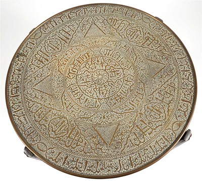Lot 301 - An early 20th century central Asian brass topped occasional table