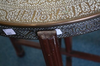 Lot 301 - An early 20th century central Asian brass topped occasional table