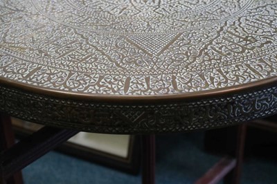 Lot 301 - An early 20th century central Asian brass topped occasional table