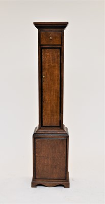 Lot 419 - An Edwardian oak gun cabinet