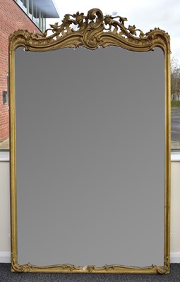 Lot 443 - A large rococo revival giltwood overmantel mirror