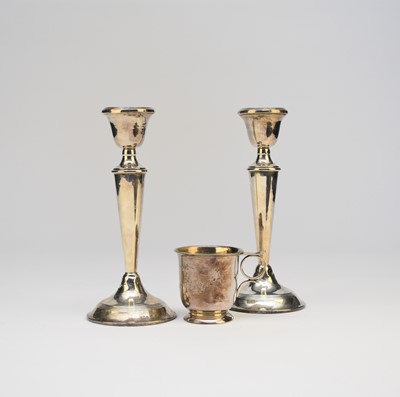Lot 19 - A pair of silver mounted candlesticks