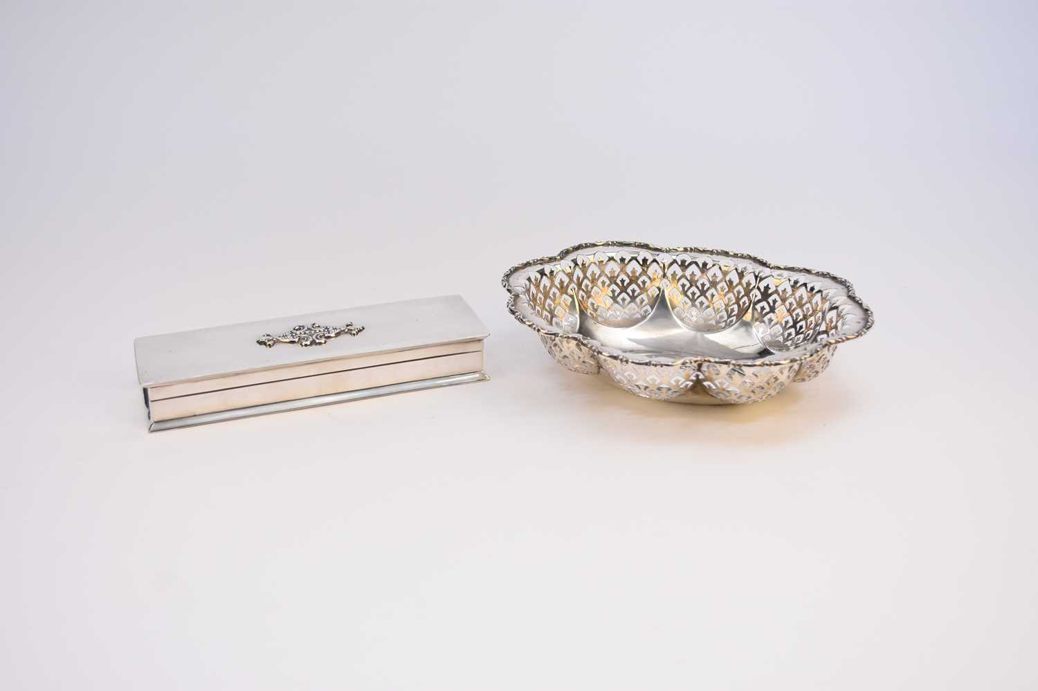 Lot 29 - A George V lobed pierced silver dish and a silver mounted cigar box