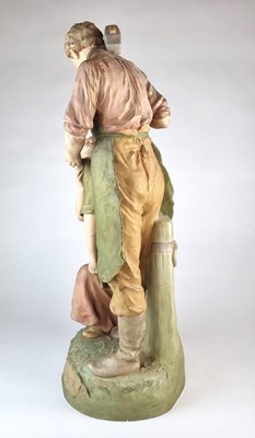 Lot 210 - A Royal Dux figural group titled 'Pax et Labor'