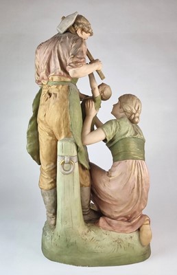 Lot 210 - A Royal Dux figural group titled 'Pax et Labor'