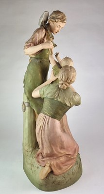 Lot 210 - A Royal Dux figural group titled 'Pax et Labor'