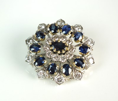 Lot 56 - A sapphire and diamond oval cluster brooch