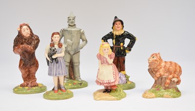 Lot 208 - Royal Doulton Wizard of Oz set and Beswick models of Cheshire Cat and Alice