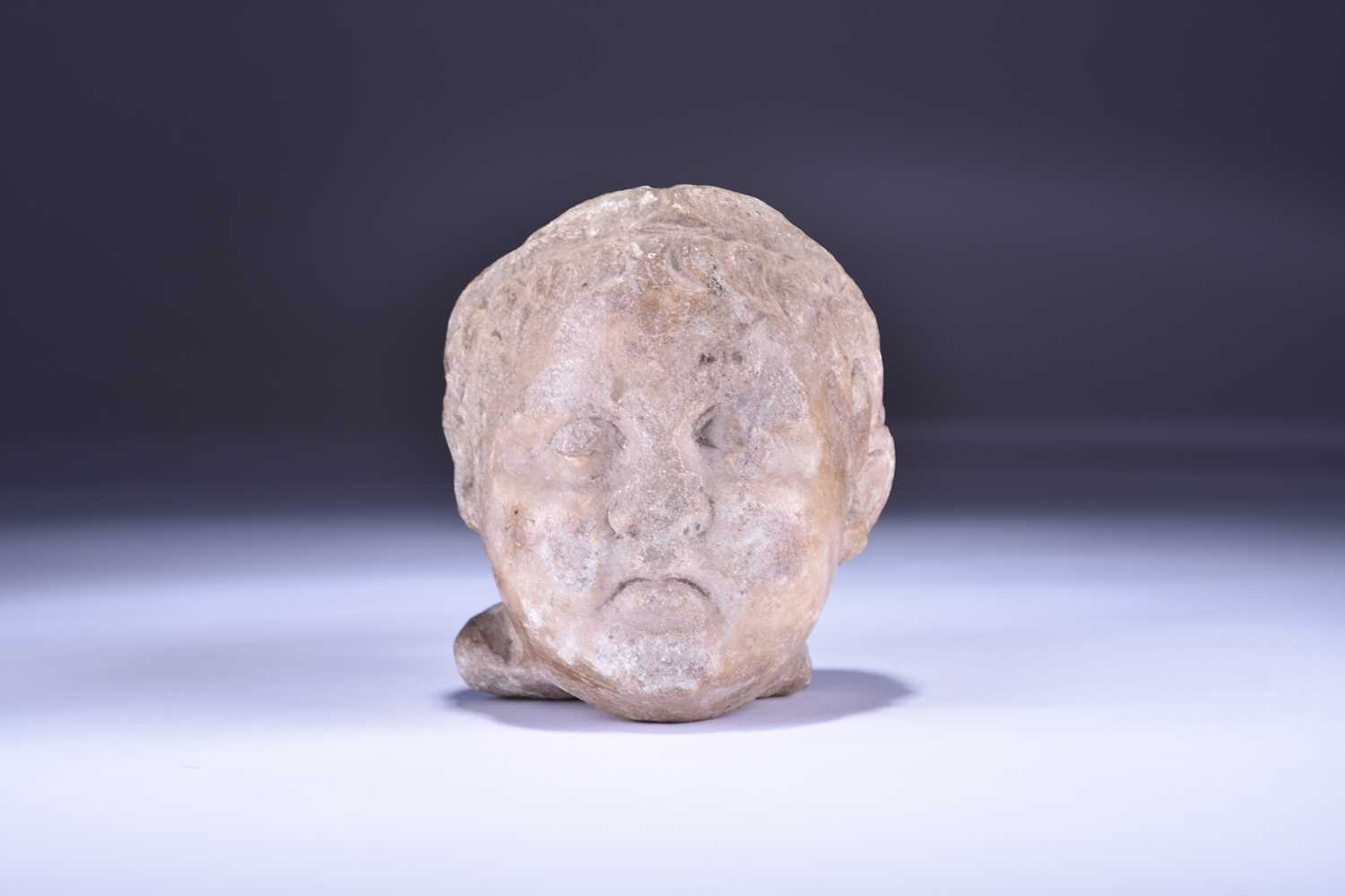 300 - A marble bust of a child, Levantine, Hellenistic period, 323-58 BC