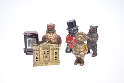 Lot 358 - A collection of cast iron and brass money boxes