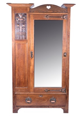 Lot 219 - Shapland and Petter of Barnstaple, an Arts & Crafts style ash single wardrobe