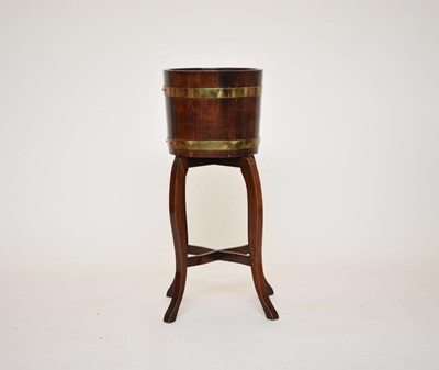 Lot 555 - A coopered oak jardiniere on later stand