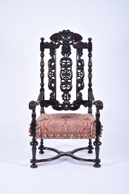 Lot 383 - A William and Mary carved walnut open armchair