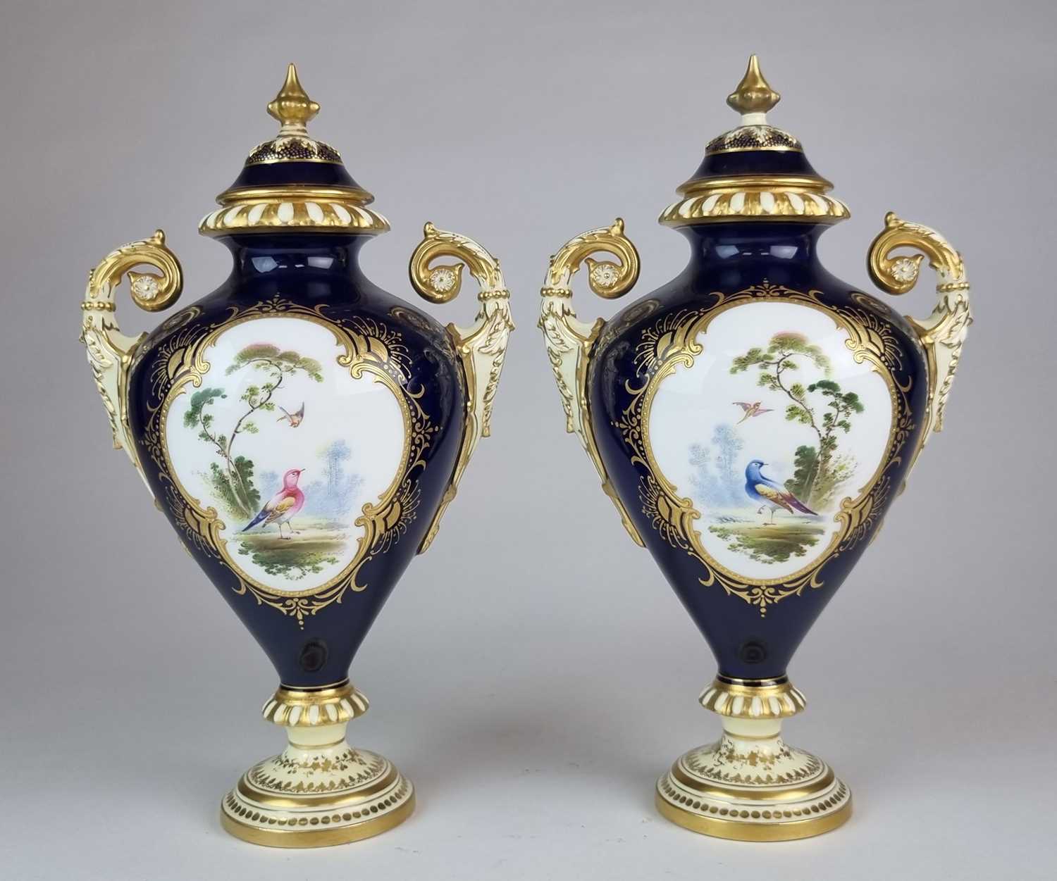 Lot 207 - A pair of Coalport vases and covers