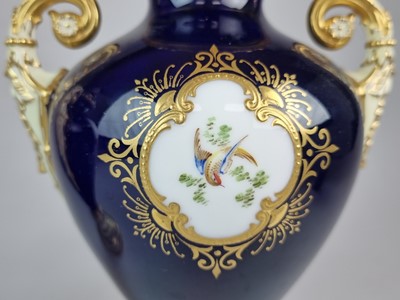 Lot 207 - A pair of Coalport vases and covers