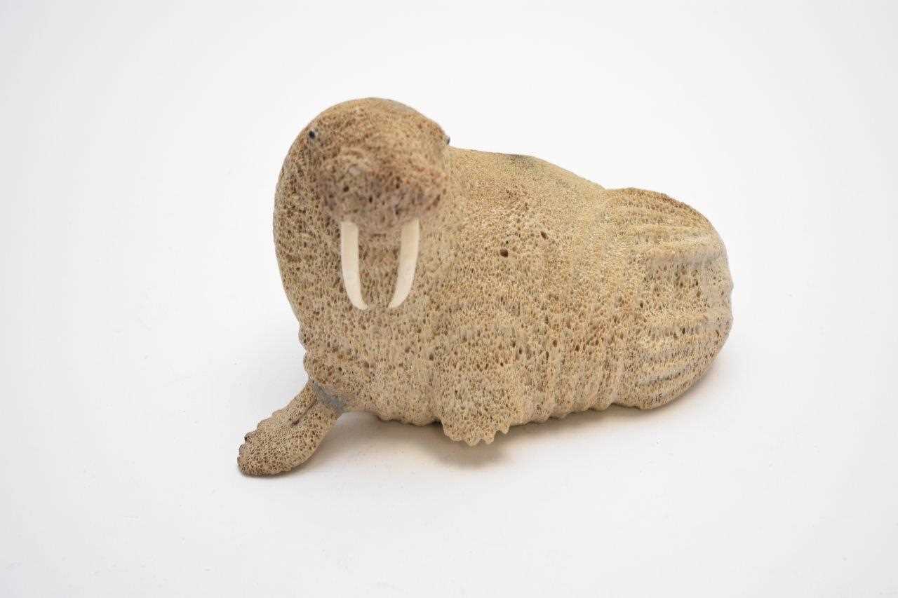 Lot 370 - Lewis Lyakitan, an Eskimo Art carved whalebone figure of a walrus
