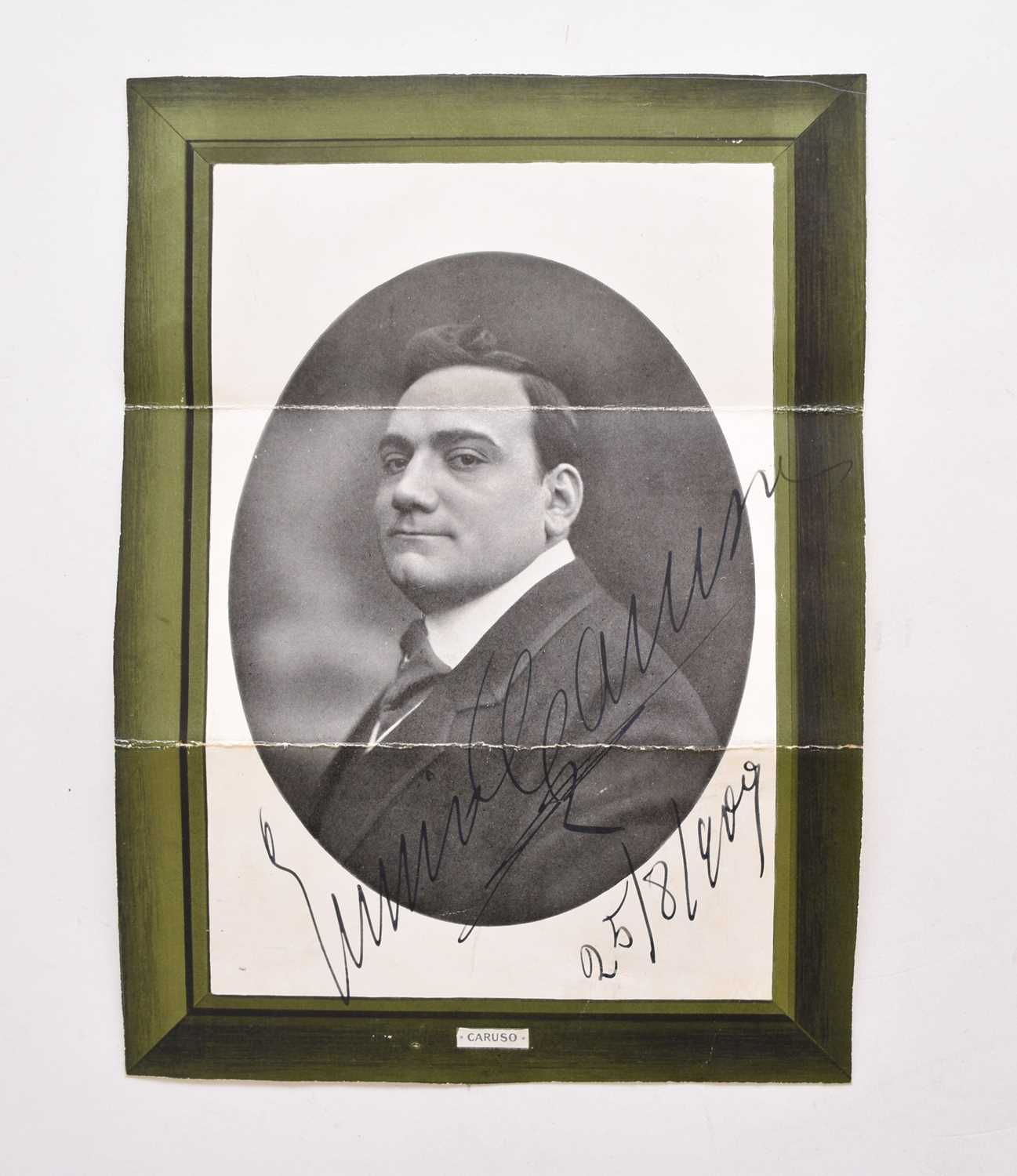 Lot 1064 - CARUSO, Enrico (1873-1921), Opera singer.  Printed photograph boldly signed and dated 25/8/1909.