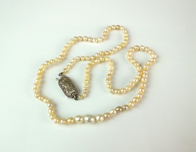 Lot 62 - An untested pearl necklace with diamond set clasp