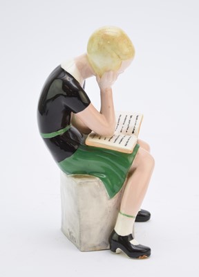 Lot 263 - A Goldscheider figure of a girl reading a book after Claire Weiss
