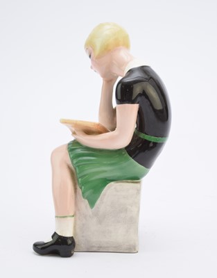 Lot 263 - A Goldscheider figure of a girl reading a book after Claire Weiss