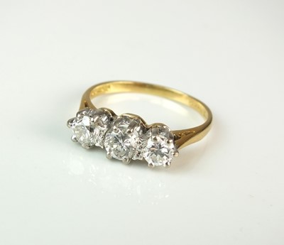 Lot 24 - An 18ct gold three stone diamond ring