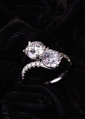 Lot 78 - A two stone diamond cross over ring